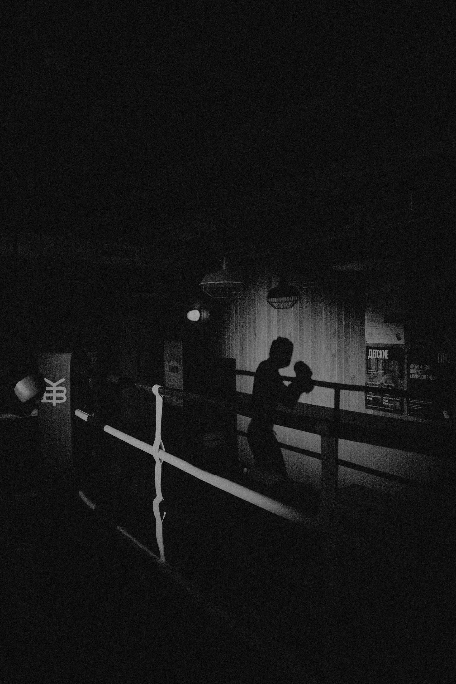 dark boxer in gym background